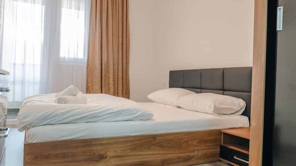Amber apartment bedroom with a double bed